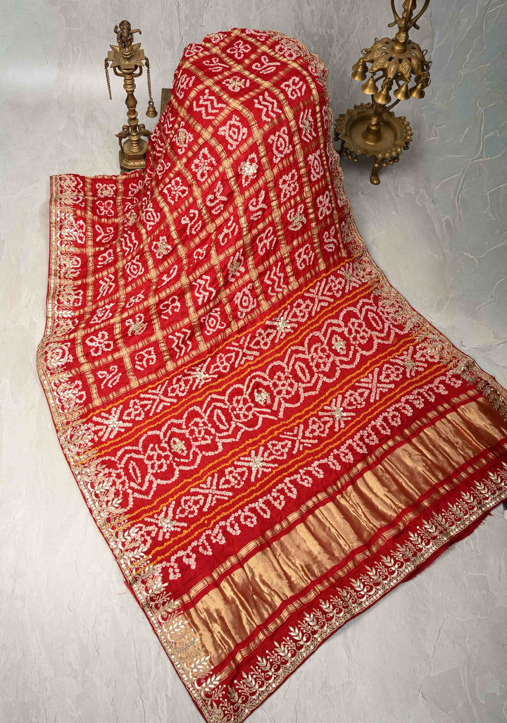 Gharchola Blood Red Sarkam Bandhej on Gajji Silk Saree with Gharchola Design and Gotta Patti Work-Crushed Pallu