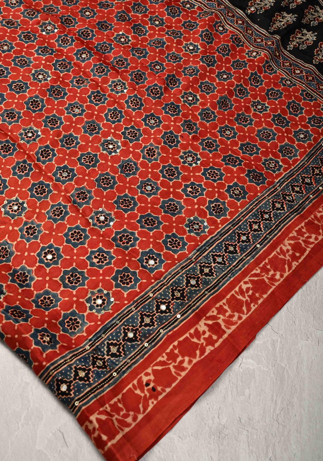 Ajrakh Hand Block Printed in Brick Red Modal Silk Saree with Aari and Mirror Work