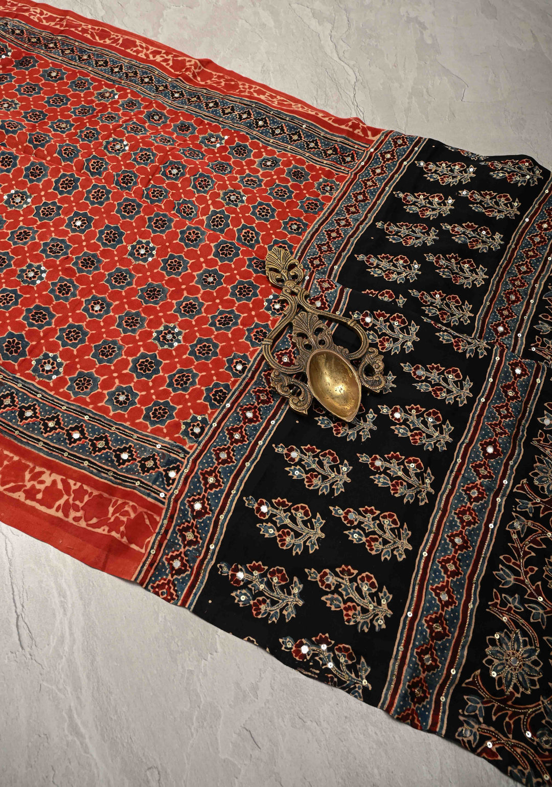Ajrakh Hand Block Printed in Brick Red Modal Silk Saree with Aari and Mirror Work