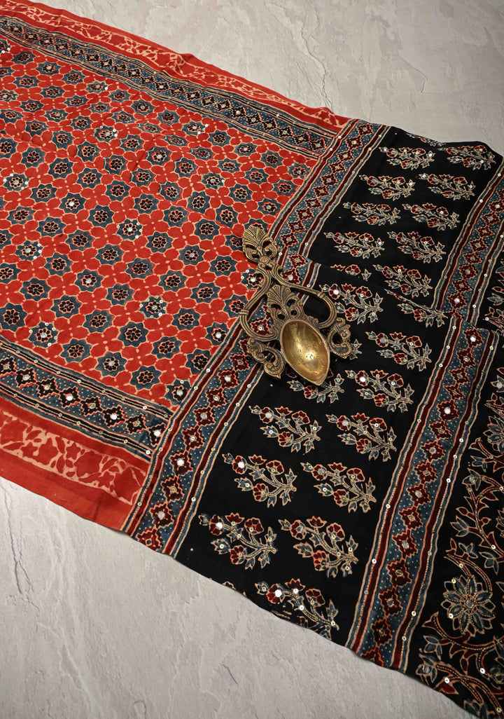 Ajrakh Hand Block Printed in Brick Red Modal Silk Saree with Aari and Mirror Work