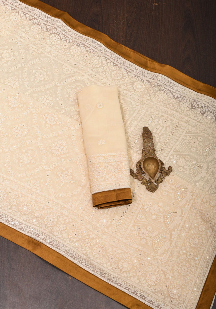 Ivory Georgette Saree with Self Embroidery and Amber Satin Trim