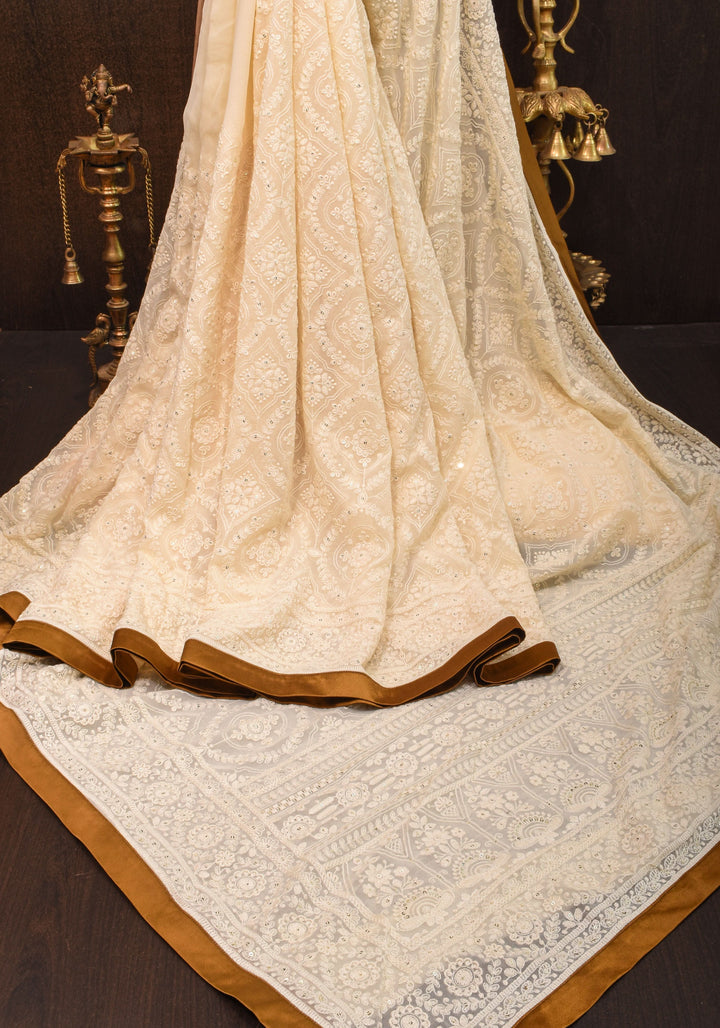 Ivory Georgette Saree with Self Embroidery and Amber Satin Trim