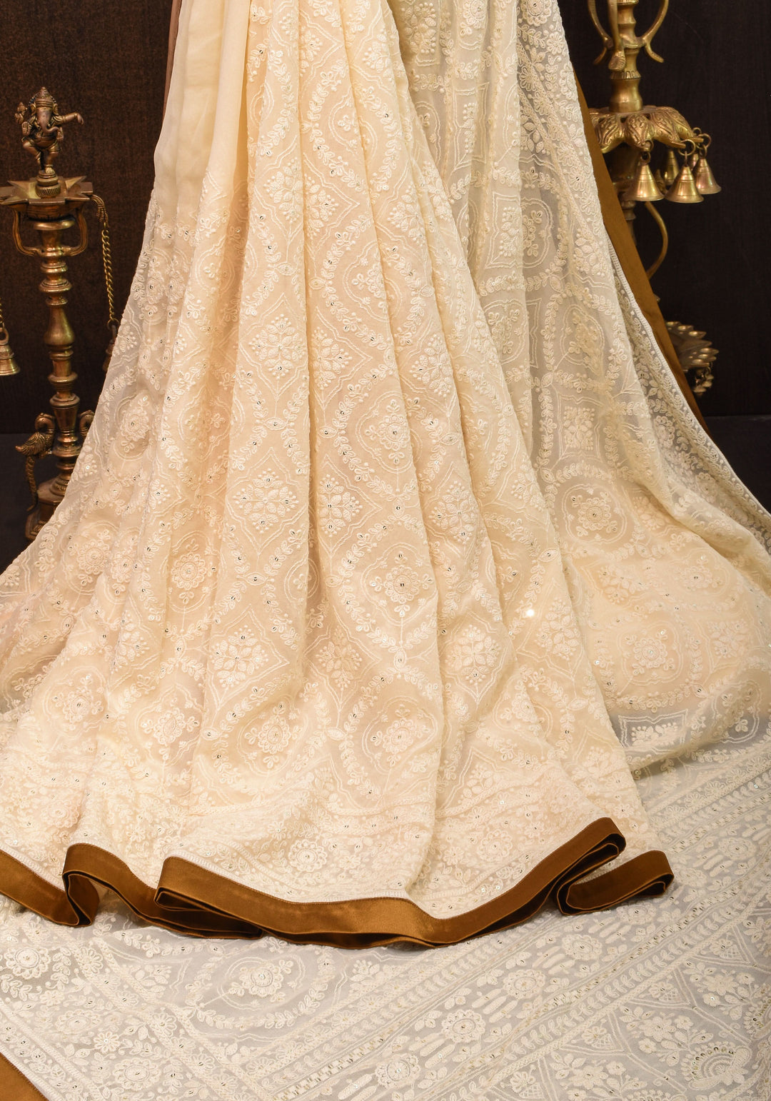 Ivory Georgette Saree with Self Embroidery and Amber Satin Trim