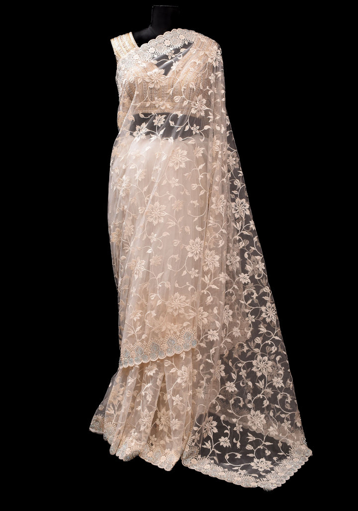 Ivory Floral Embroidery Design with Stone work on Net Saree and Scallop Border