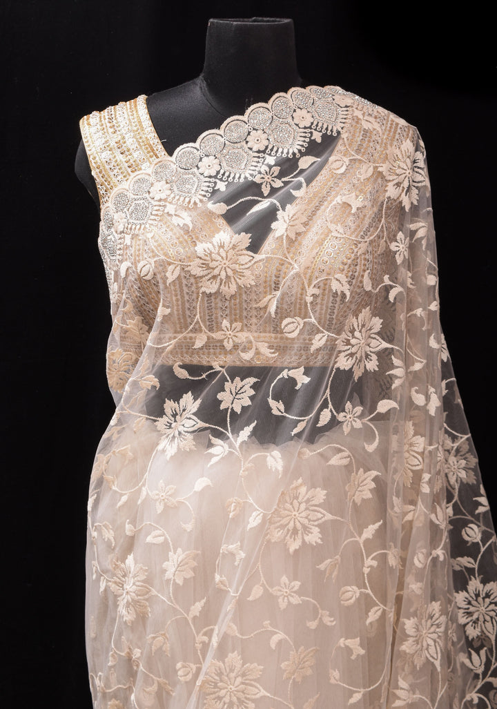 Ivory Floral Embroidery Design with Stone work on Net Saree and Scallop Border