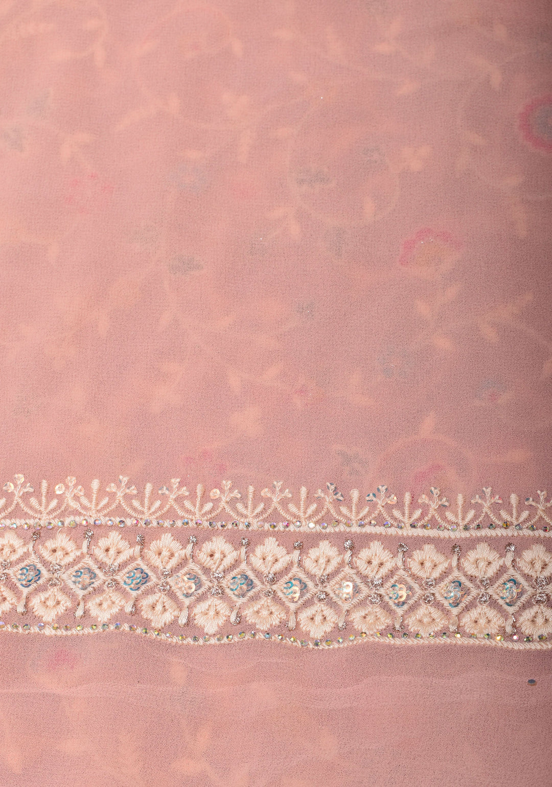 Georgette Saree with Floral Embroidery in Dusty Peach with Dainty Stones Embellishments | SHOBITAM