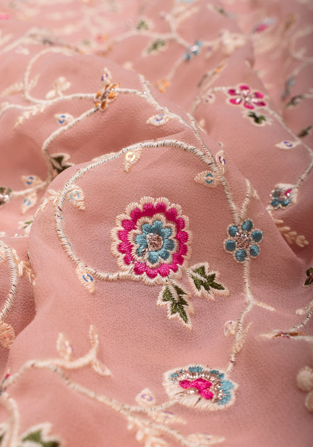 Georgette Saree with Floral Embroidery in Dusty Peach with Dainty Stones Embellishments | SHOBITAM