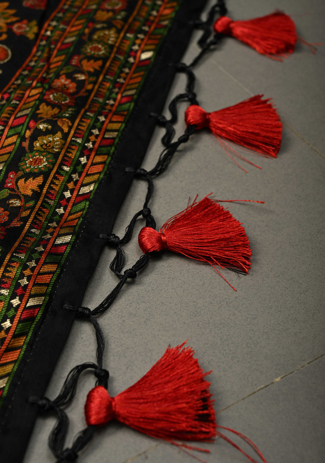 Black Rayon Saree adorned with a Traditional Kani Floral Jaal Pattern. | SHOBITAM