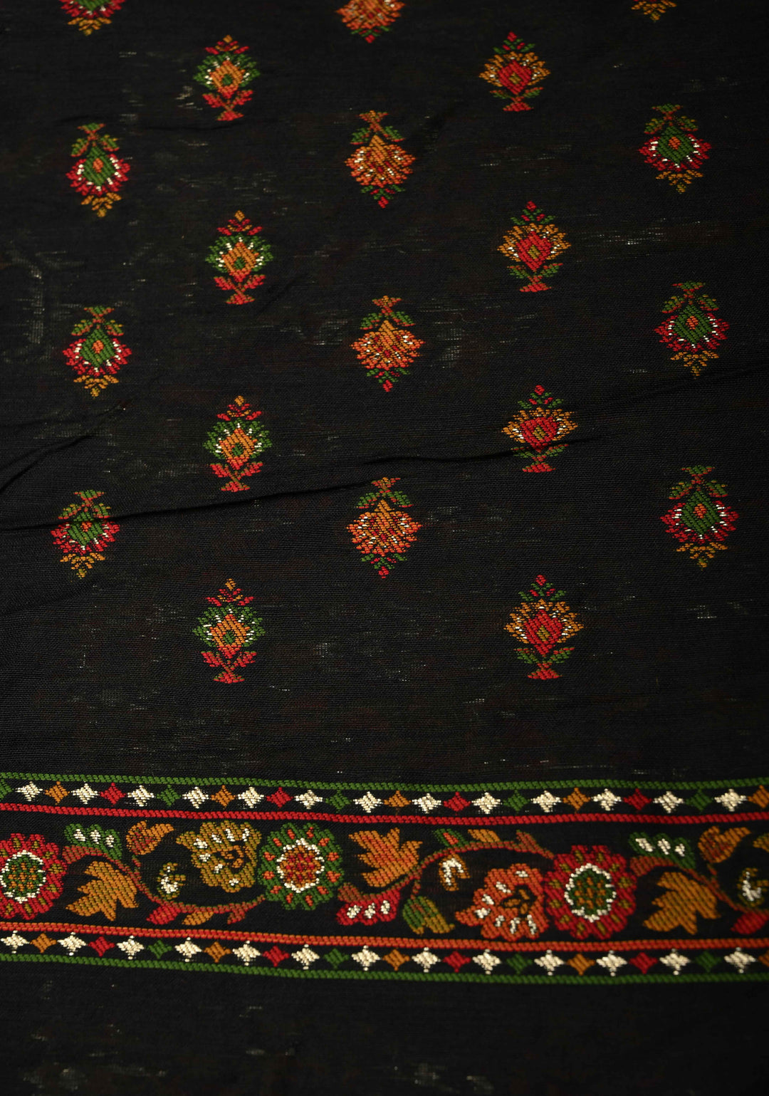 Black Rayon Saree adorned with a Traditional Kani Floral Jaal Pattern. | SHOBITAM