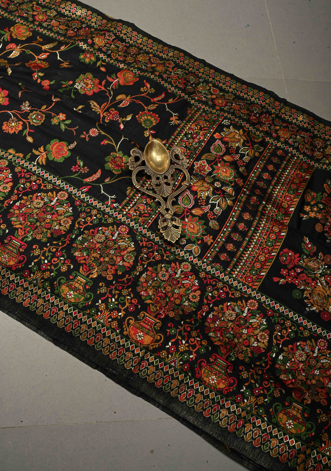 Black Rayon Saree adorned with a Traditional Kani Floral Jaal Pattern. | SHOBITAM