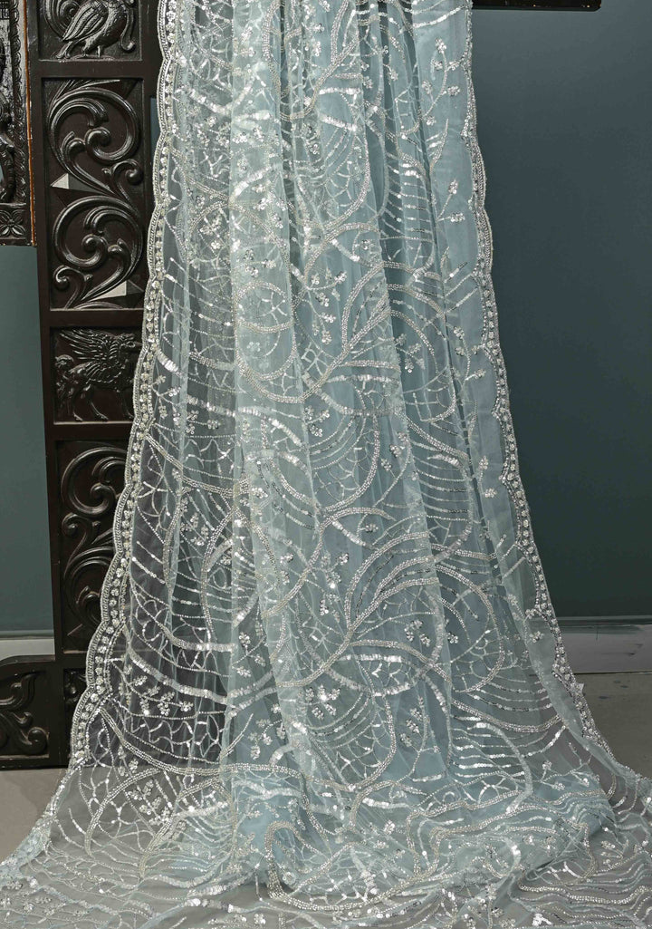 Powder Blue Swirling Design Sequins, Cutdana on Net Saree with Scallop Border | SHOBITAM