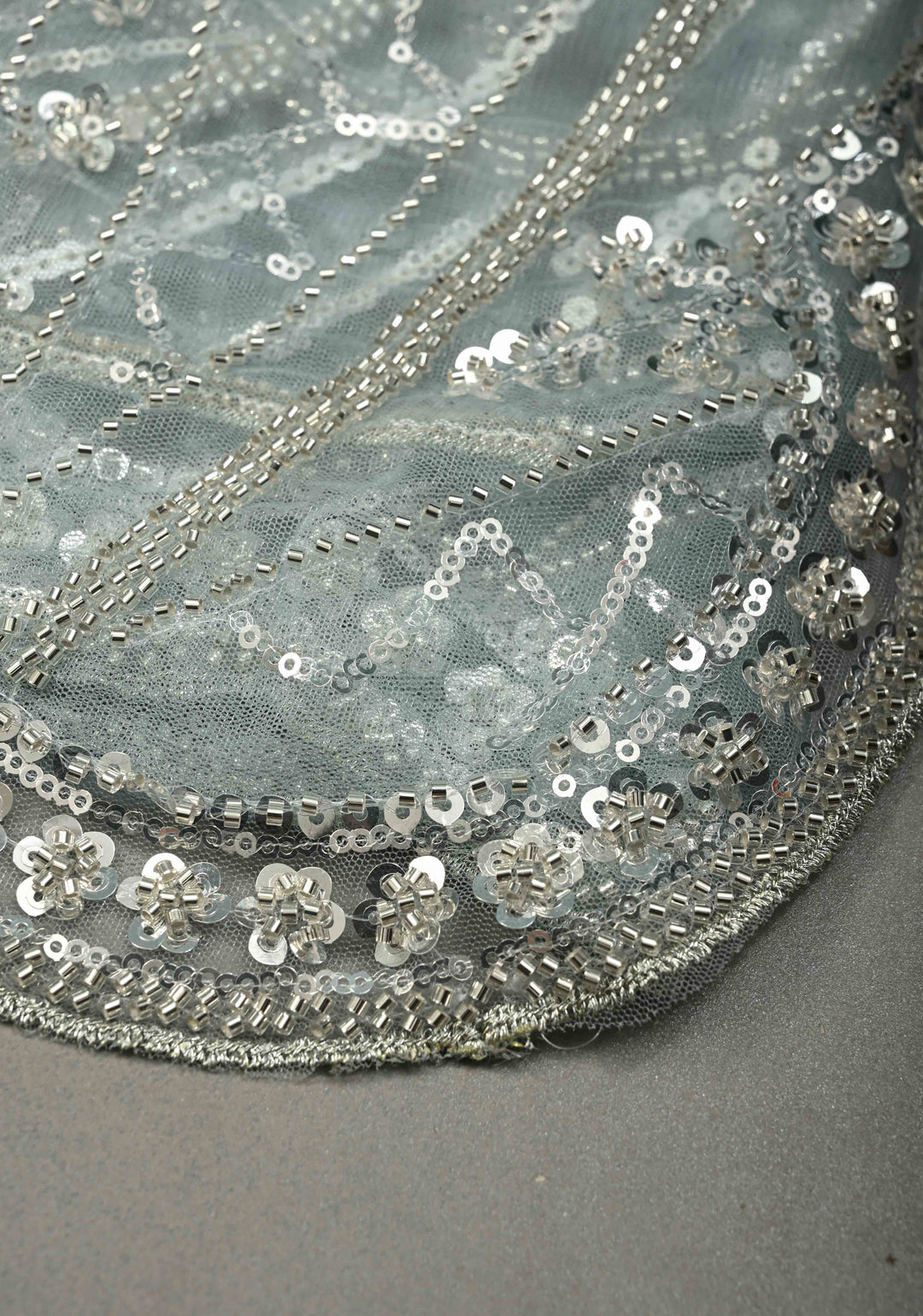 Powder Blue Swirling Design Sequins, Cutdana on Net Saree with Scallop Border | SHOBITAM