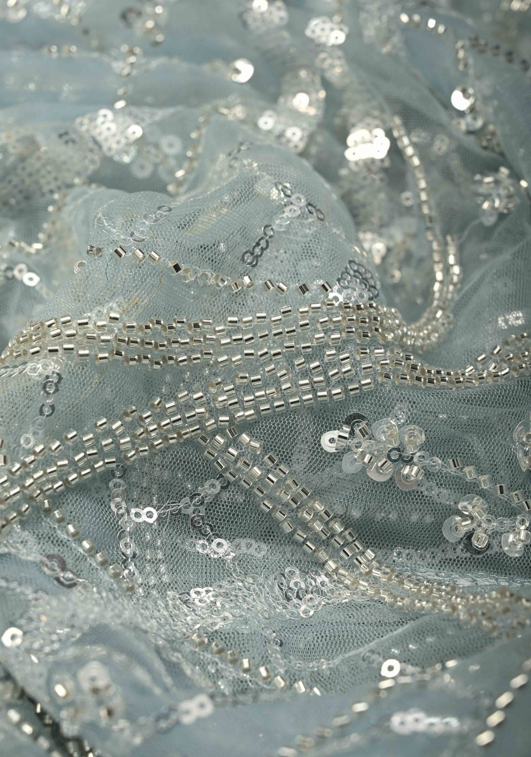 Powder Blue Swirling Design Sequins, Cutdana on Net Saree with Scallop Border | SHOBITAM