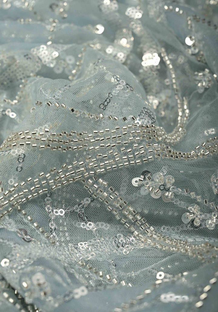Powder Blue Swirling Design Sequins, Cutdana on Net Saree with Scallop Border | SHOBITAM