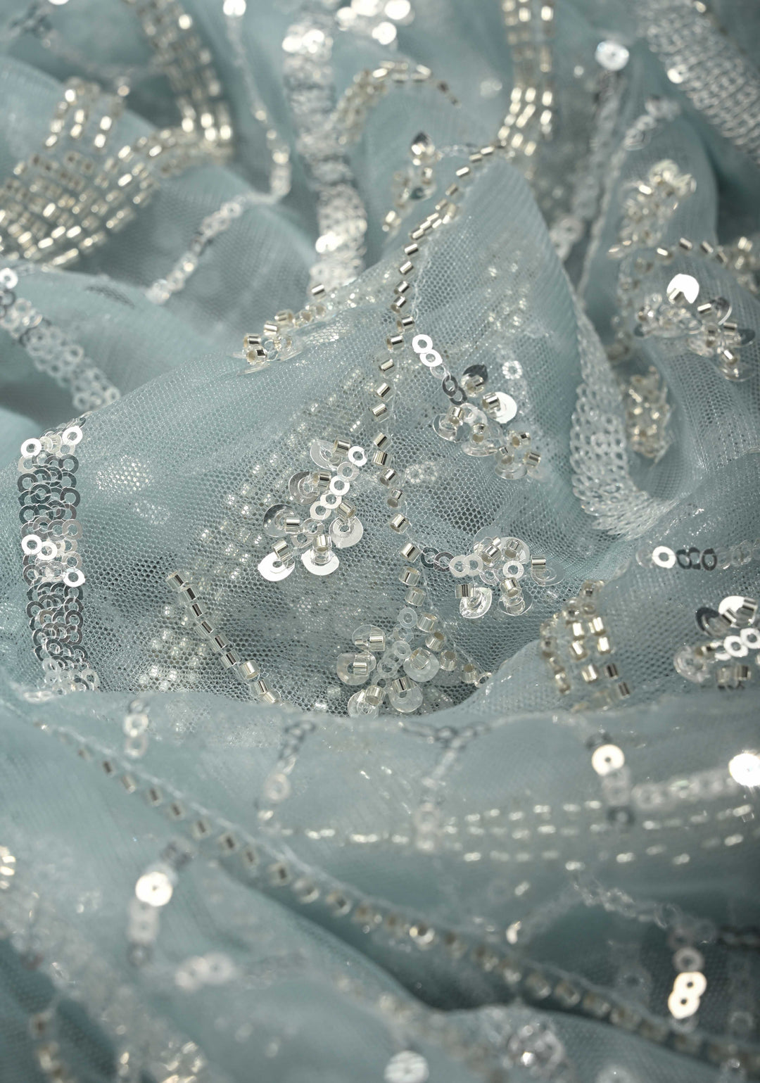 Powder Blue Swirling Design Sequins, Cutdana on Net Saree with Scallop Border | SHOBITAM