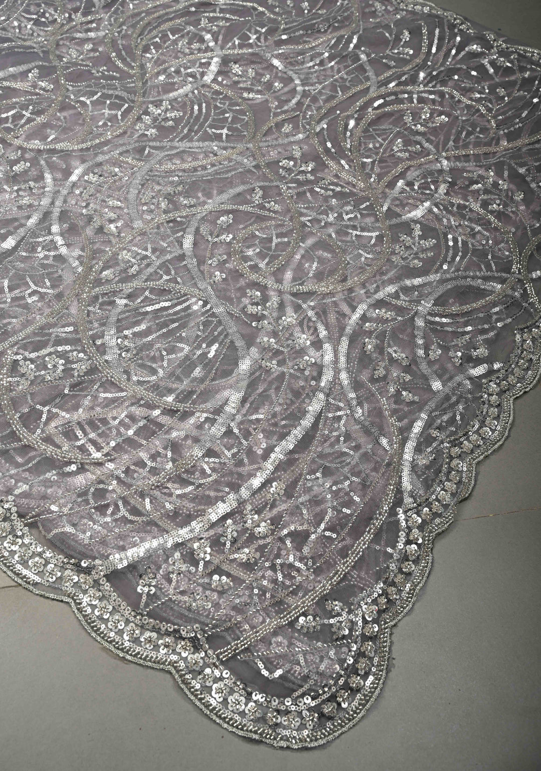 Mauve Swirling Design Sequins, Cutdana on Net Saree with Scallop Border | SHOBITAM
