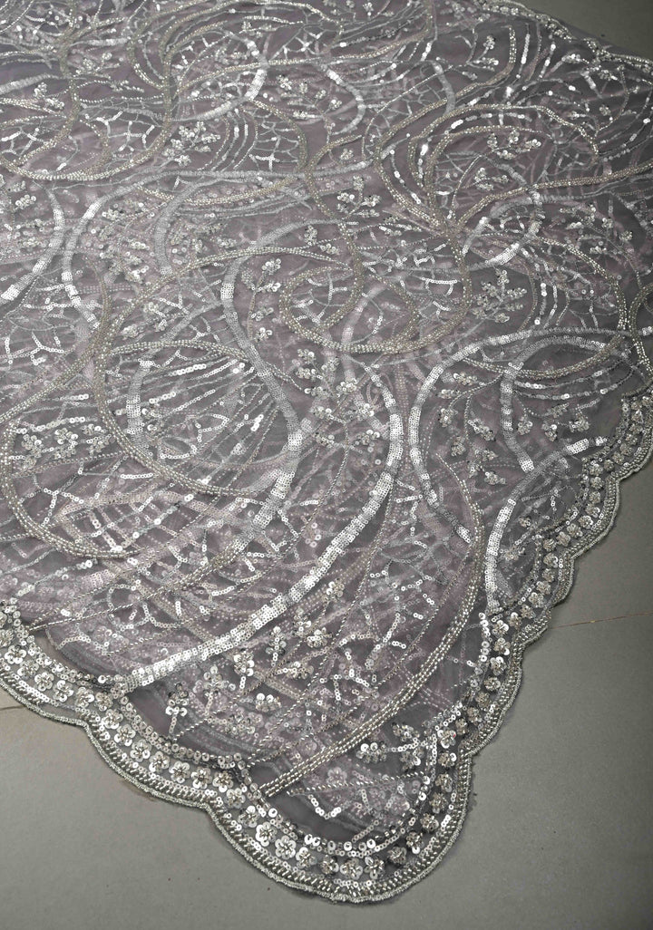 Mauve Swirling Design Sequins, Cutdana on Net Saree with Scallop Border | SHOBITAM