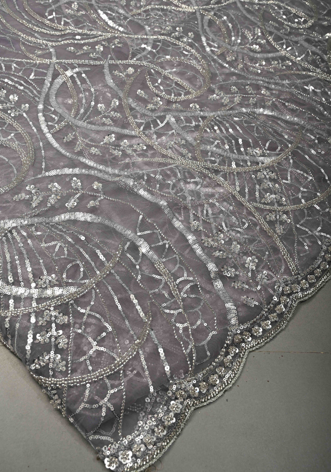Mauve Swirling Design Sequins, Cutdana on Net Saree with Scallop Border | SHOBITAM