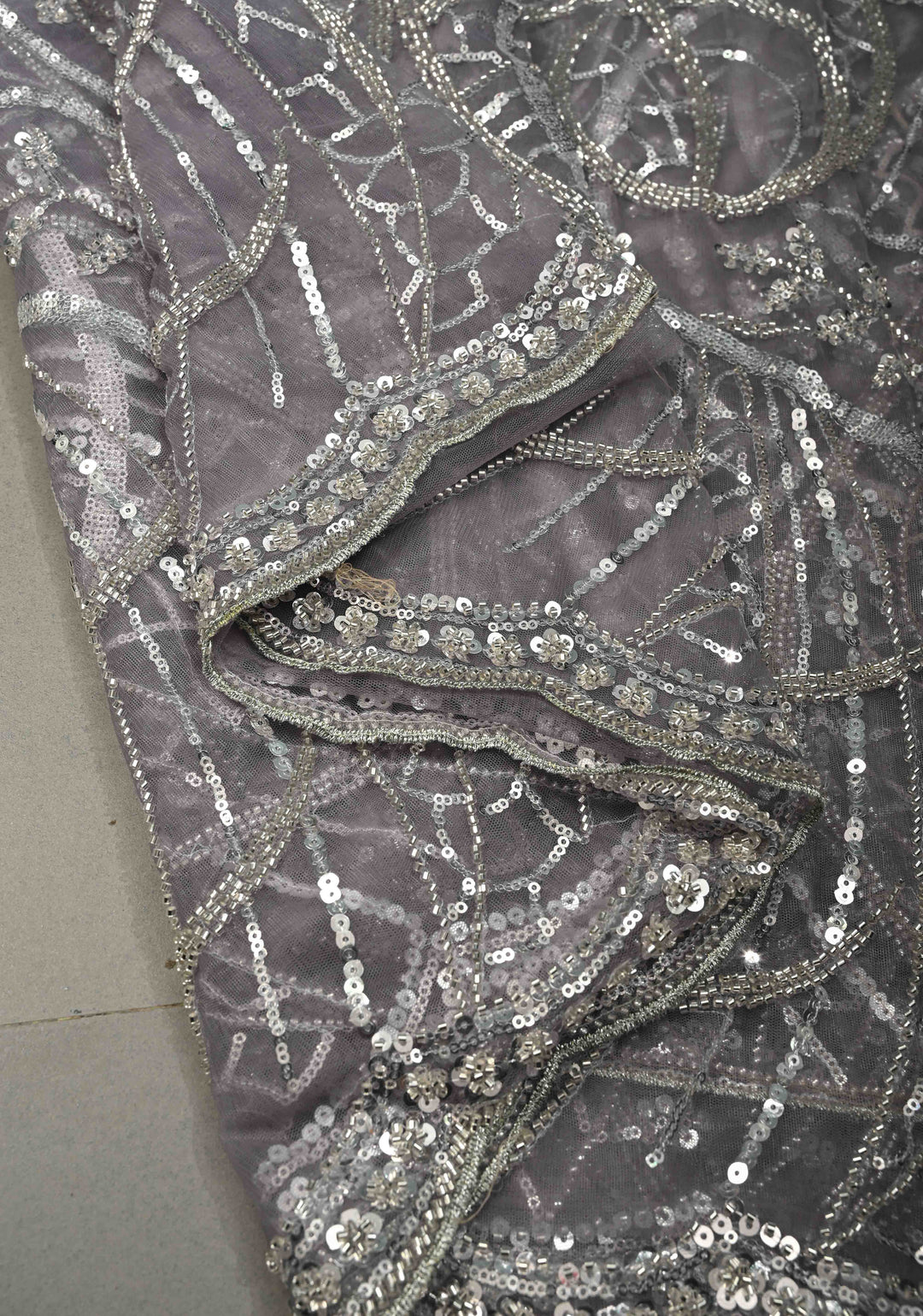 Mauve Swirling Design Sequins, Cutdana on Net Saree with Scallop Border | SHOBITAM