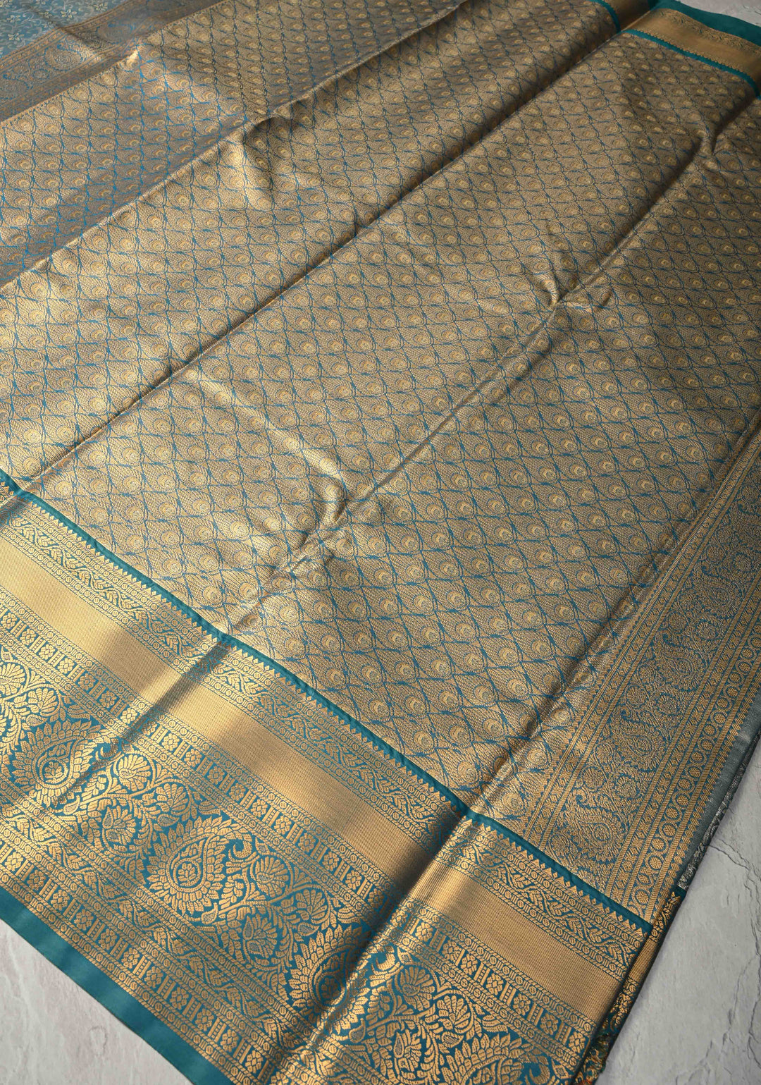 Teal Blue Kanjivaram Tissue Semi Silk Saree with Meenakari Brocade and Contrast Zari Border