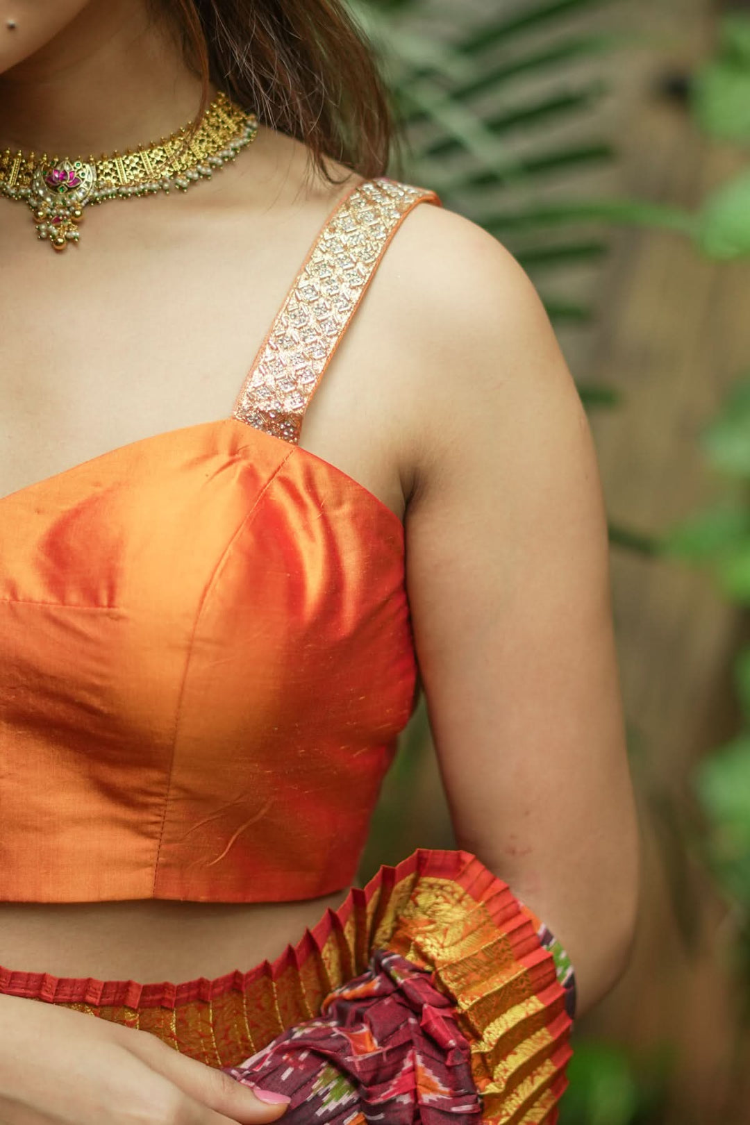 Strappy Blouse in Orange Silk with Sweetheart neckline and cutdana embellishments | SHOBITAM