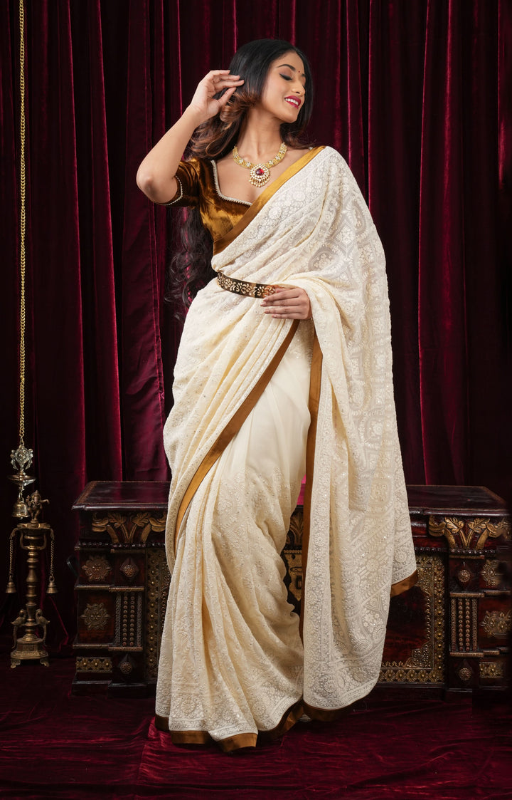 Ivory Georgette Saree with Self Embroidery and Amber Satin Trim