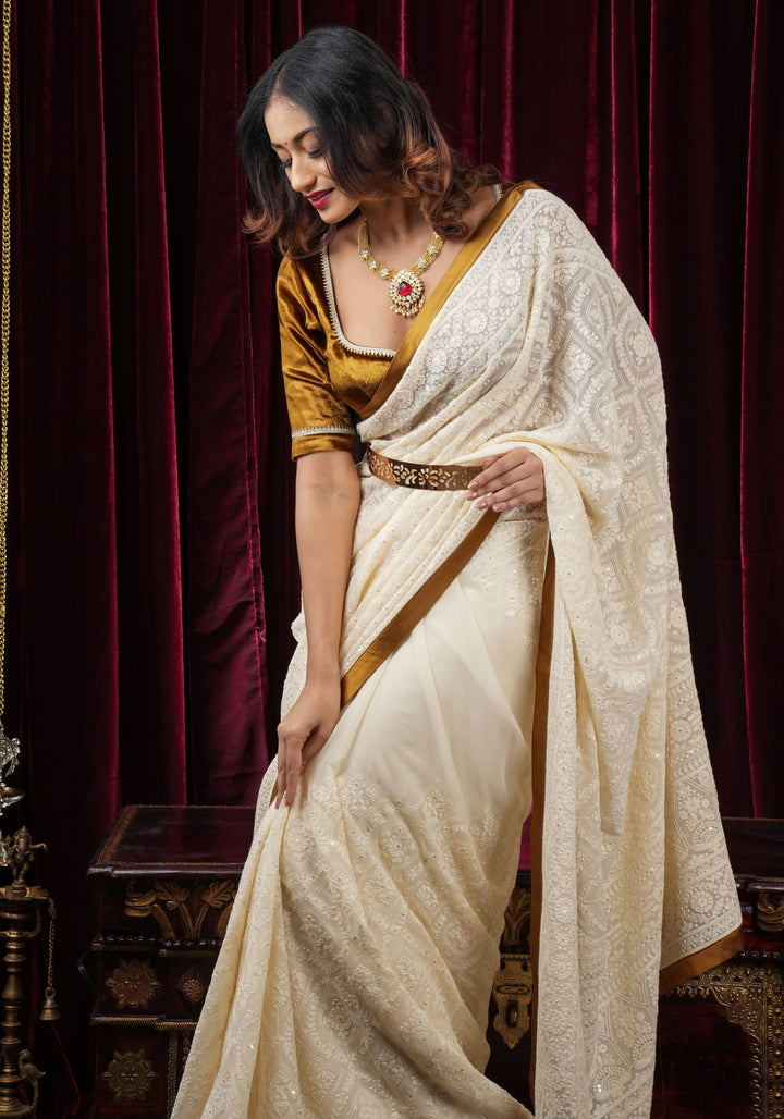 Ivory Georgette Saree with Self Embroidery and Amber Satin Trim
