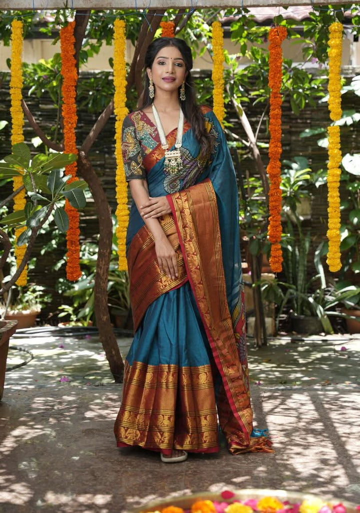 PreOrder: Peacock blue Narayanpet saree with pen kalamkari appliqué and wide zari borders