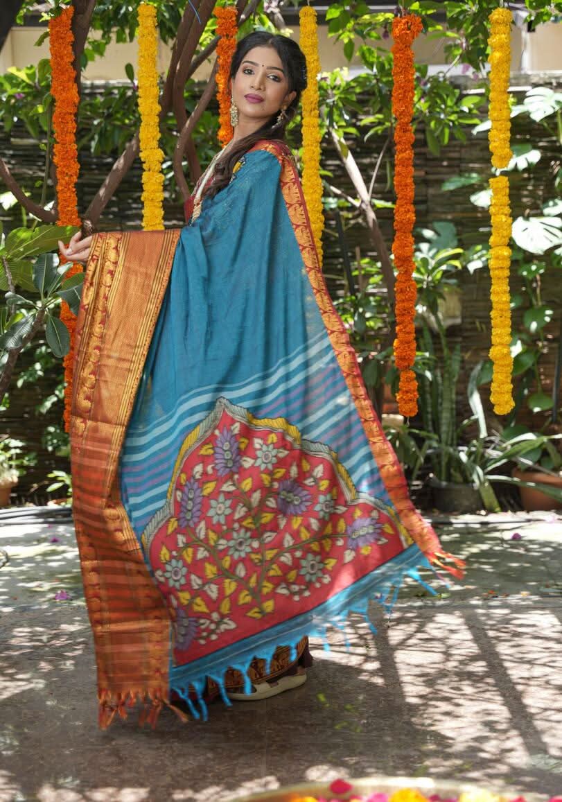 PreOrder: Peacock blue Narayanpet saree with pen kalamkari appliqué and wide zari borders
