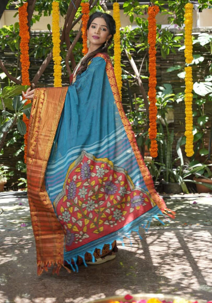 PreOrder: Peacock blue Narayanpet saree with pen kalamkari appliqué and wide zari borders