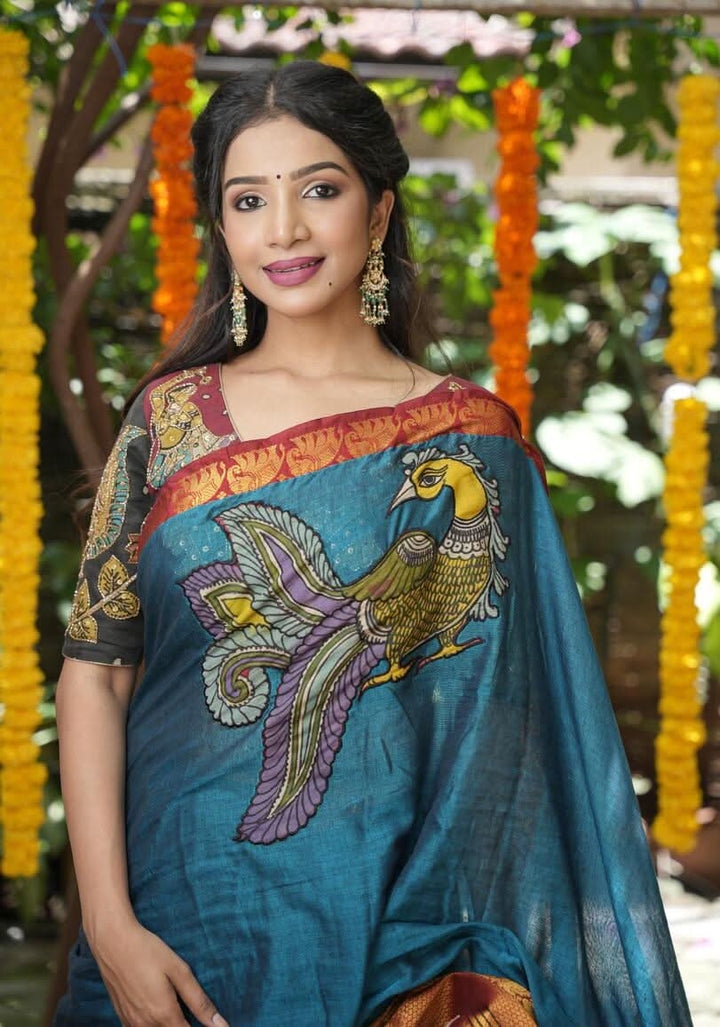 PreOrder: Peacock blue Narayanpet saree with pen kalamkari appliqué and wide zari borders
