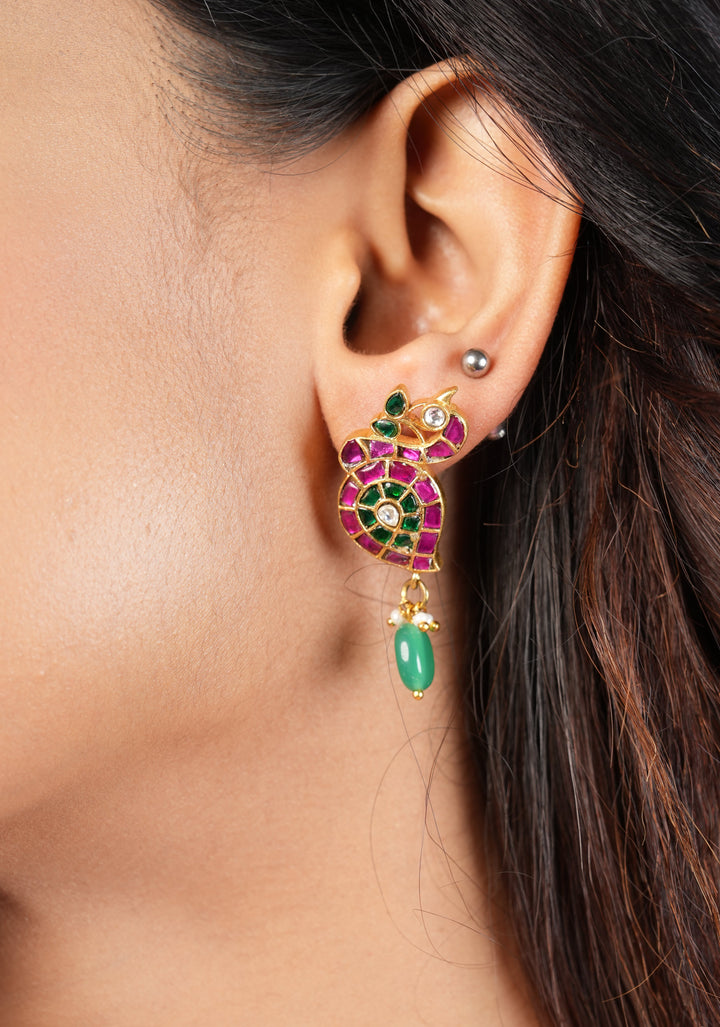 Handcrafted Jadau Peacock Earrings in Pink ,Green and  White color with dangling Green Bead | Shobitam Jewelry