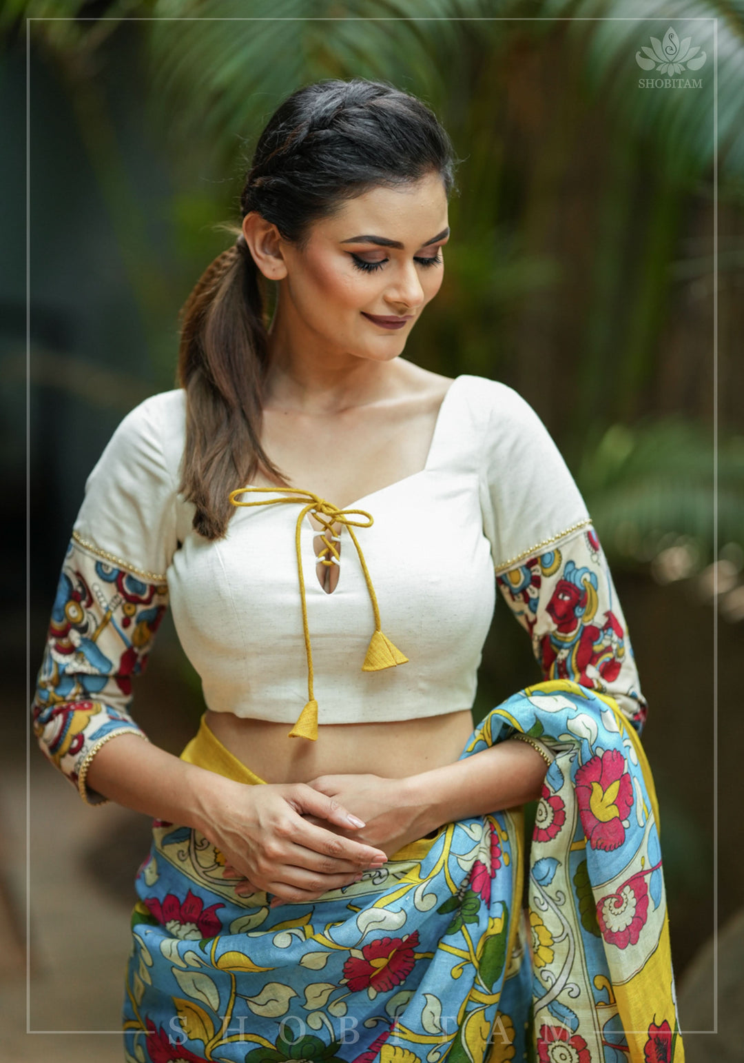 Porcelain white square neck blouse with handpainted kalamkari sleeve detailing.