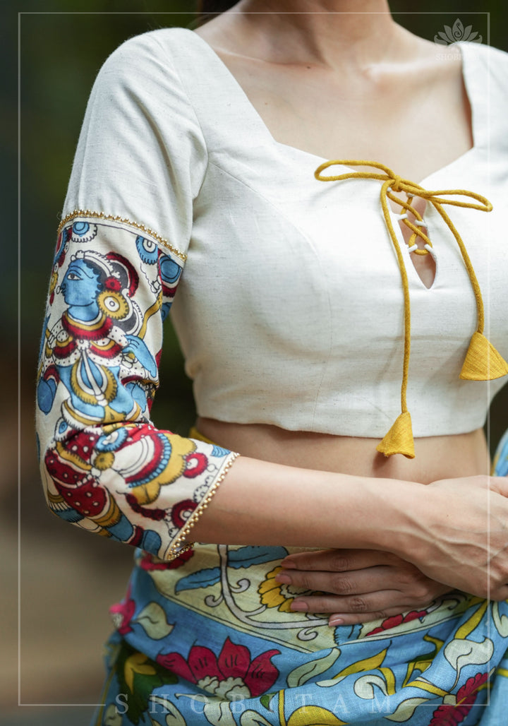 Porcelain white square neck blouse with handpainted kalamkari sleeve detailing.