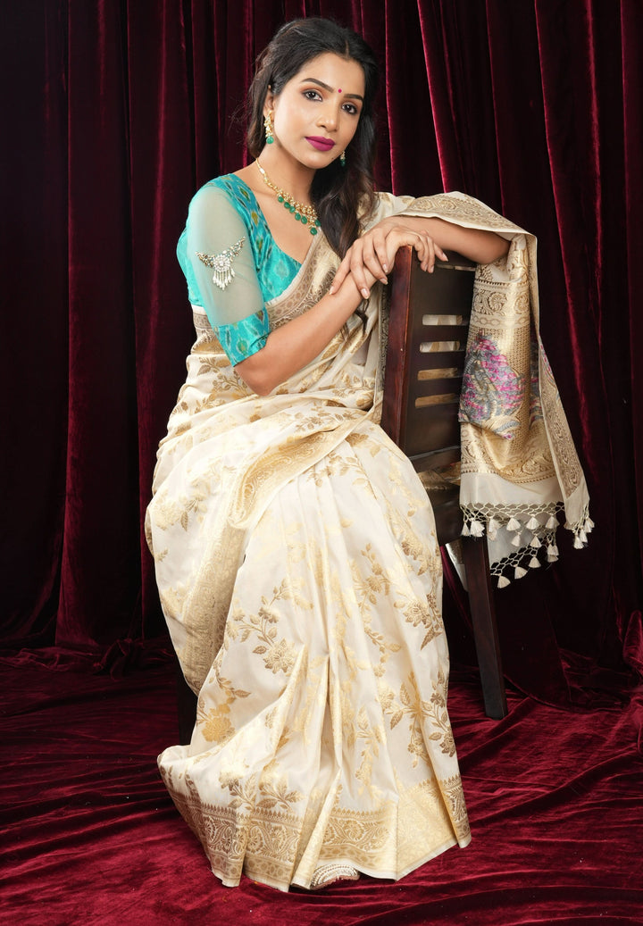 Ivory Tissue Semi silk saree with leheria Zari Floral vine Pattern and Meenakari Zari Pallu