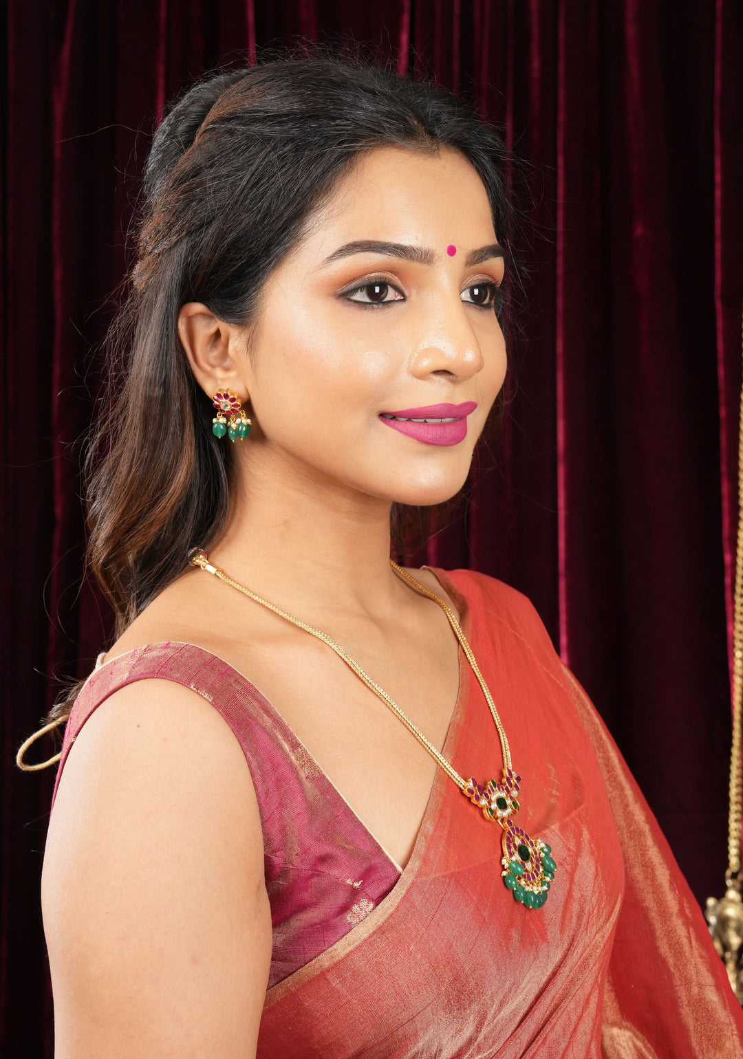 Deep Square Neck Sleeveless blouse in Reddish pink Pure Tissue Raw silk with zari buttas