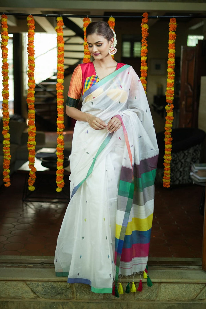 Handwoven Maheshwari Mercerised Cotton Saree  in  White  with Satrangi pallu with long colorful  Tasslels | SHOBITAM