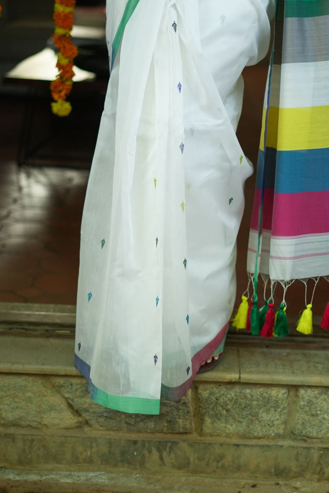 Handwoven Maheshwari Mercerised Cotton Saree  in  White  with Satrangi pallu with long colorful  Tasslels | SHOBITAM