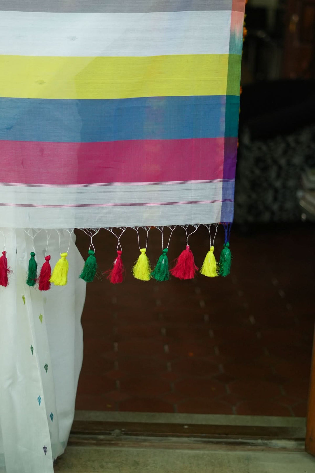 Handwoven Maheshwari Mercerised Cotton Saree  in  White  with Satrangi pallu with long colorful  Tasslels | SHOBITAM