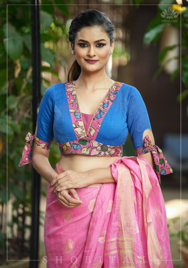 Ocean blue handloom V neck blouse with rose pink handpainted kalamkari border detailing.