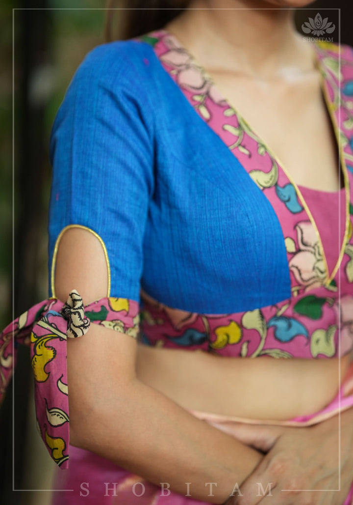 Ocean blue handloom V neck blouse with rose pink handpainted kalamkari border detailing.