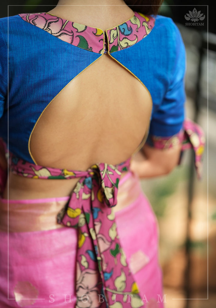 Ocean blue handloom V neck blouse with rose pink handpainted kalamkari border detailing.