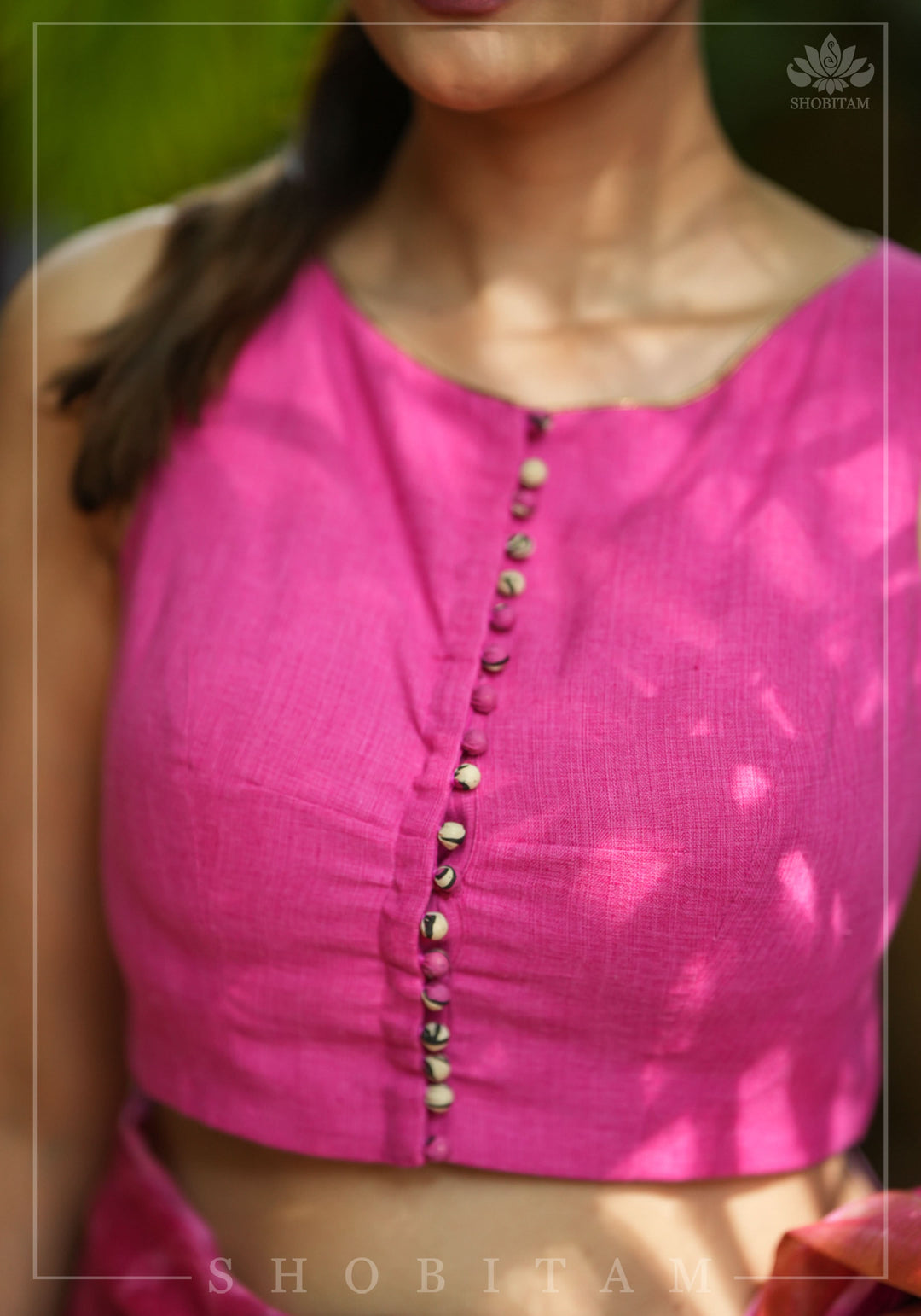Pink handloom sleeveless Blouse with potli button detailing in front and Kalamkari applique in back | SHOBITAM