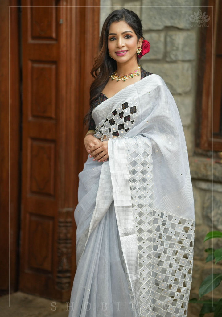 Silver Cutwork and Mirror Work Tissue Linen Saree in White Silver