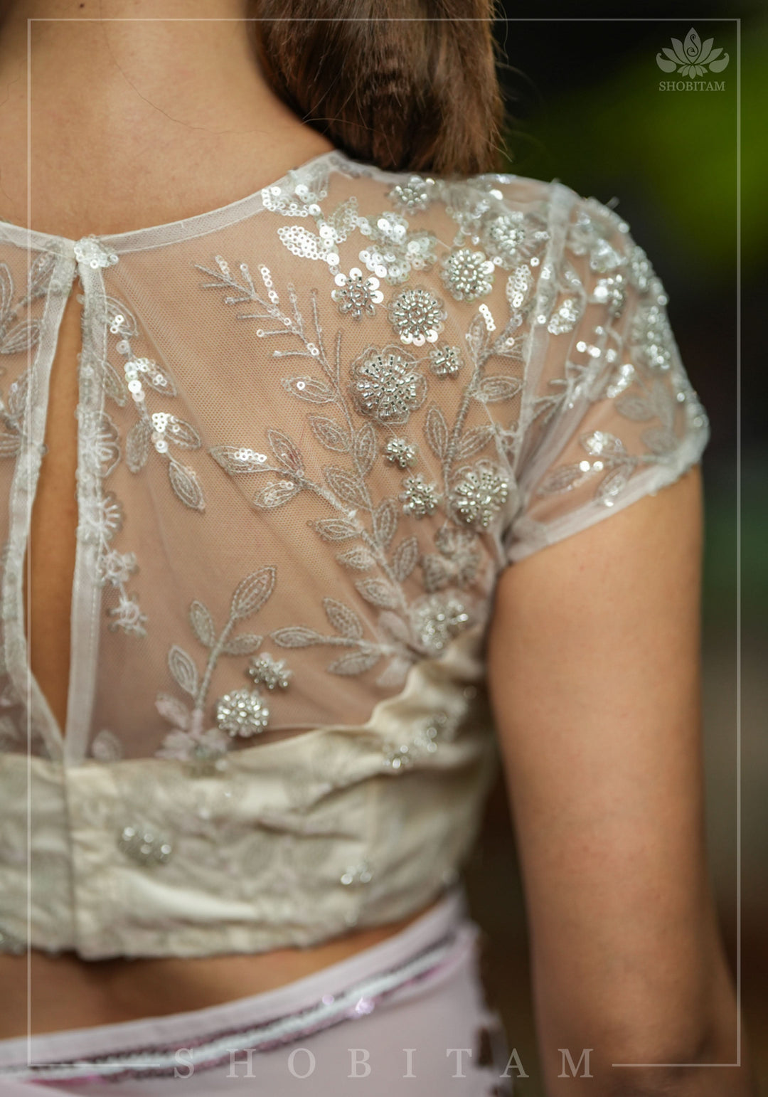 Stunning Ivory Net Blouse with Sheer Yoke and Shimmering Floral Design Sequins