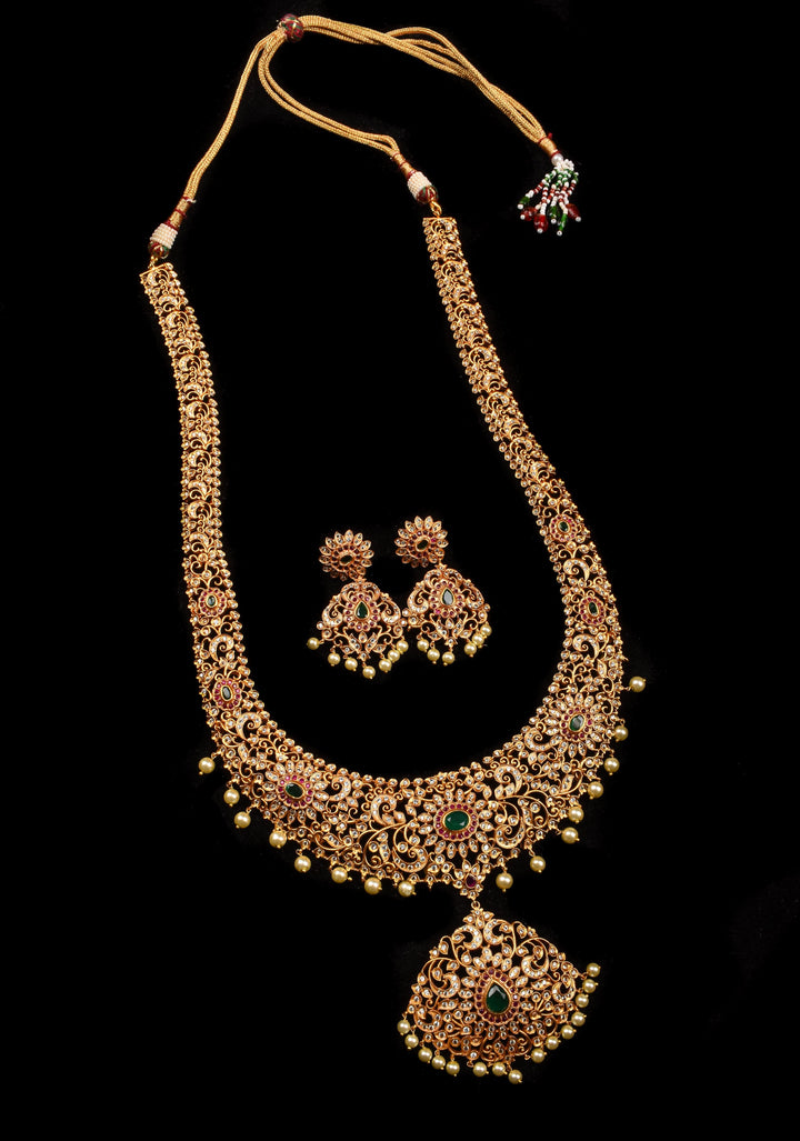 Timeless Elegance: Intricate Gold-Finish Long Haram Set with Gemstones and Pearls