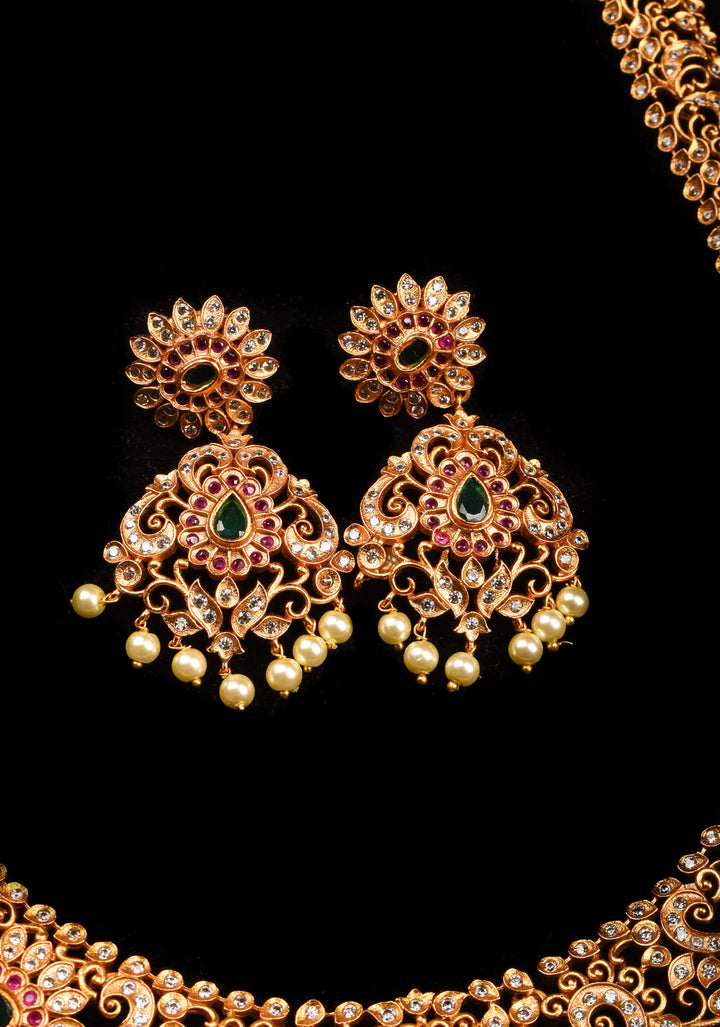 Timeless Elegance: Intricate Gold-Finish Long Haram Set with Gemstones and Pearls