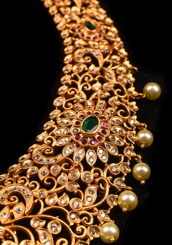 Timeless Elegance: Intricate Gold-Finish Long Haram Set with Gemstones and Pearls