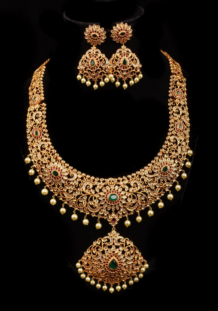 Timeless Elegance: Intricate Gold-Finish Long Haram Set with Gemstones and Pearls