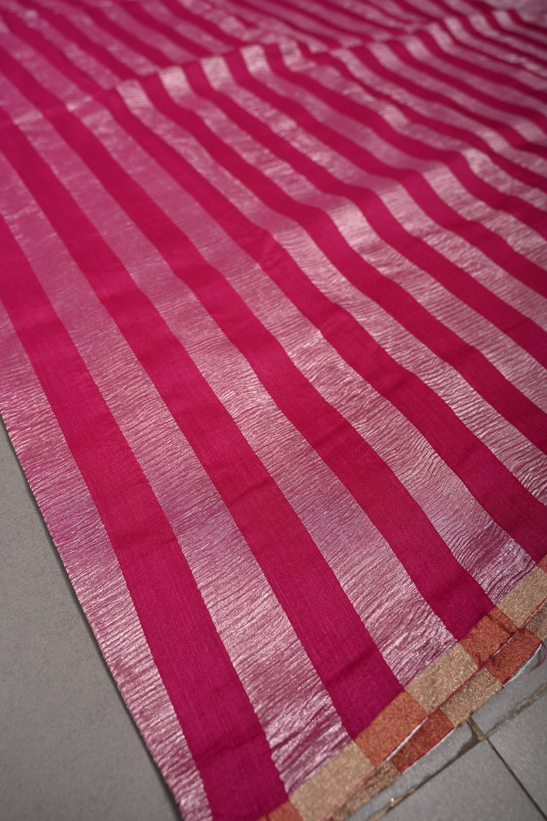 Rani Pink Georgette Saree with Crushed Tissue Vertical Stripes and Minimalist Zari Border